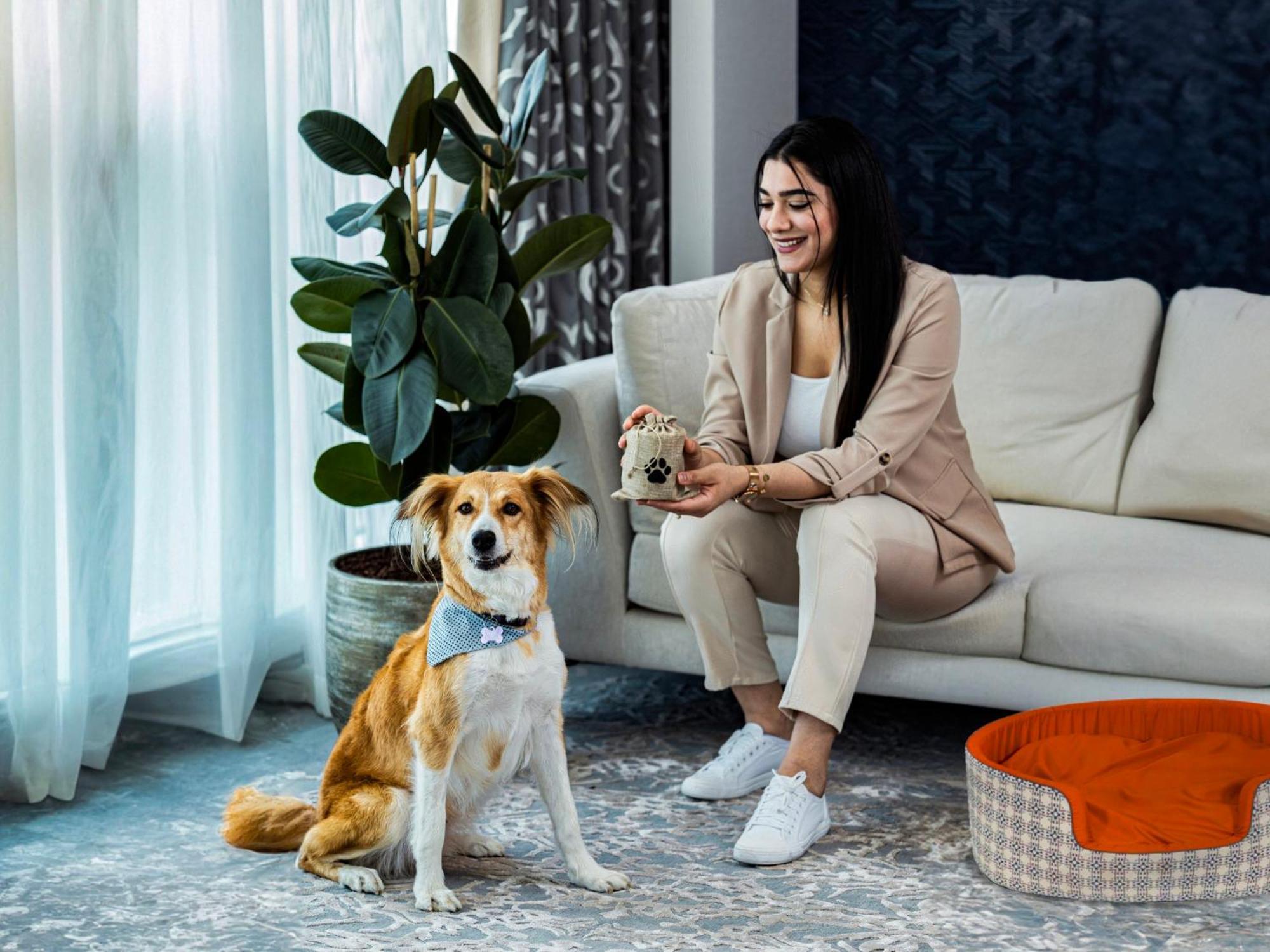 Abesq Doha Hotel And Residences, An Ihg Hotel Exterior photo A dog with its owner